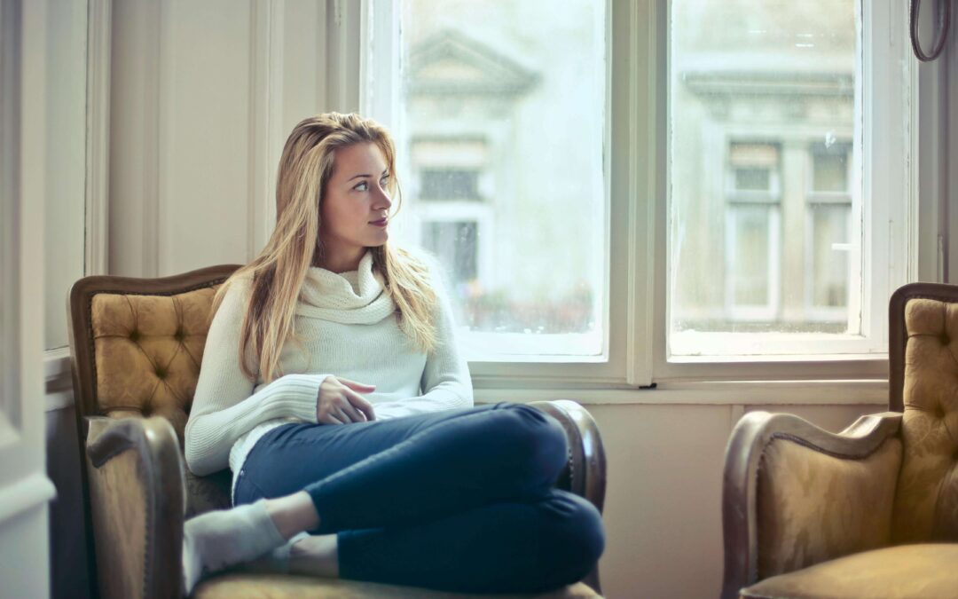 Woman at home on a comfy chair