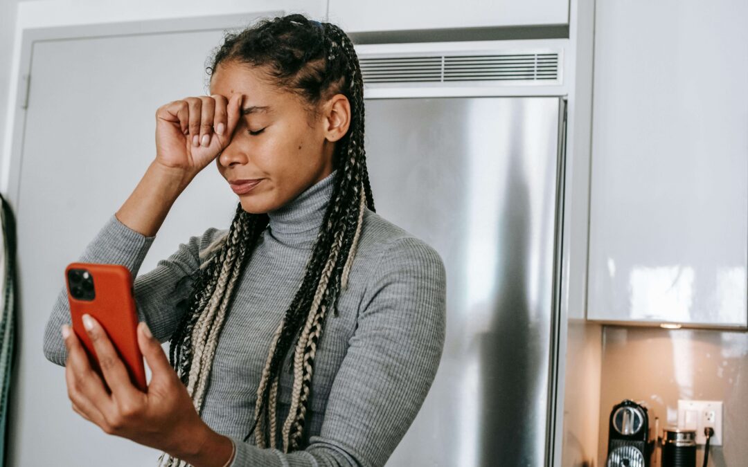 Woman on the phone looking frustrated